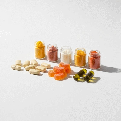 Assortment of Vitamin C supplements in various forms like tablets, gummies, and powders